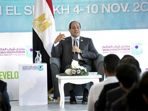 FILE - In this photo dated Tuesday, Nov. 7, 2017, provided by Egypt's state news agency, MENA, Egyptian President Abdel-Fattah el-Sissi participates in a meeting with a group of young people from around the world, at the "World Youth Forum," a government-organized event, in the Red Sea resort of Sharm el-Sheikh, Egypt.  el-Sissi said Wednesday Nov. 8, 2017, that Iran must stop "meddling" in the region's affairs and asking for dialogue so that the security of Arab Gulf countries is not be threatened. (MENA file via AP)