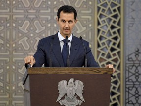 FILE - In this Aug. 20, 2017, file photo, released by the official Facebook page of the Syrian Presidency, Syrian President Bashar Assad speaks to Syrian diplomats, in Damascus, Syria. Assad's reputation in the west is shattered, his nation is a smoldering ruin and around half the country is controlled by domestic and foreign militias. But through it all, Assad appears to have survived the war, strangely holding on to his seat in at least the near-term. (Syrian Presidency Facebook page via AP, File)