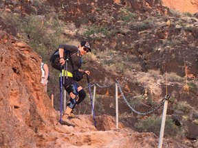 A hiker descends a chained path on the Havasupai Trail near Supai, Arizona in November, 2017. A Grand Canyon hike is on almost every dedicated hikers list, and the hike to Havasupai Falls is even more coveted because of the aqua-green waterfalls of the Havasu Creek.THE CANADIAN PRESS/Terri Theodore