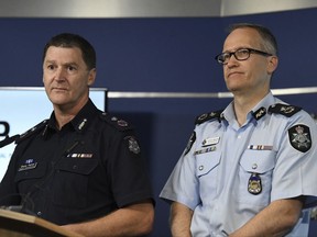 Australian Federal Police, Acting Deputy Commissioner Ian McCartney, right, and Victoria State Police Deputy Commissioner Shane Patton address the media at the Victorian Police Centre in Melbourne Tuesday, Nov. 28, 2017.  Australian police have arrested a man accused of planning a mass shooting for New Year's Eve in a crowded Melbourne square, officials said on Tuesday. (James Ross/AAP Image via AP)