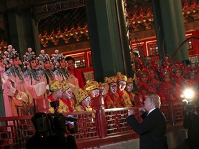 President Donald Trump, center meets opera performers, at the Forbidden City, Wednesday, Nov. 8, 2017, in Beijing, China. Trump is on a five country trip through Asia traveling to Japan, South Korea, China, Vietnam and the Philippines. (AP Photo/Andrew Harnik)
