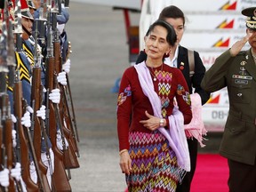 FILE - Nov. 11, 2017, file photo, Myanmar leader Aung San Suu Kyi arrives at Clark International Airport, north of Manila, Philippines to attend the 31st ASEAN Summit and Related Summits in Manila. When Suu Kyi led the fight for democracy against Myanmar's despotic military rulers two decades ago, she bristled at the collective reluctance of Southeast Asian governments to intervene in her nation's plight. Today, Suu Kyi leads Myanmar. And when she attends the ASEAN summit on Monday, Nov. 13, 2017, she's likely to be counting on the bloc to keep silent amid international criticism of her government's role in the exodus of more than 600,000 Rohingya Muslims from Myanmar to Bangladesh. (AP Photo/Bullit Marquez, File)