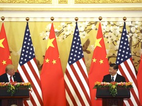 U.S. President Donald Trump and Chinese President Xi Jinping, right, look at each other during a joint press conference at the Great Hall of the People, Thursday, Nov. 9, 2017, in Beijing. Trump is on a five-country trip through Asia traveling to Japan, South Korea, China, Vietnam and the Philippines. (AP Photo/Andrew Harnik)