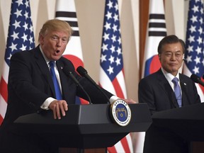 U.S. President Donald Trump, left, speaks as South Korean President Moon Jae-In listens during a joint press conference at the presidential Blue House in Seoul, South Korea, Tuesday, Nov. 7, 2017. (Jung Yeon-Je/Pool Photo via AP)