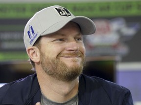 Dale Earnhardt Jr. smiles during a media availability before Sunday's NASCAR Cup series auto race at Texas Motor Speedway in Fort Worth, Texas, Friday, Nov. 3, 2017. (AP Photo/LM Otero)