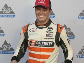 Erik Jones poses in Victory Lane after taking the pole position during qualifying for a NASCAR Xfinity series auto race at Texas Motor Speedway in Fort Worth, Texas, Saturday, Nov. 4, 2017. (AP Photo/LM Otero)