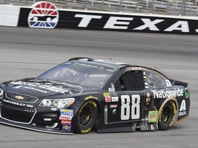 Dale Earnhardt Jr. (88) drives during a practice session for a NASCAR Cup series auto race at Texas Motor Speedway in Fort Worth, Texas, Friday, Nov. 3, 2017. (AP Photo/Larry Papke)