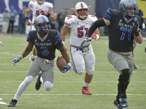 Memphis wide receiver Anthony Miller (3) carries the ball ahead of SMU defensive tackle Pono Davis (51) as Memphis offensive lineman Gabe Kuhn (71) looks to block in the first half of an NCAA college football game Saturday, Nov. 18, 2017, in Memphis, Tenn. (AP Photo/Brandon Dill)
