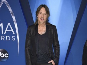 Keith Urban arrives at the 51st annual CMA Awards on Wednesday, Nov. 8, 2017, in Nashville, Tenn. (Photo by Evan Agostini/Invision/AP)