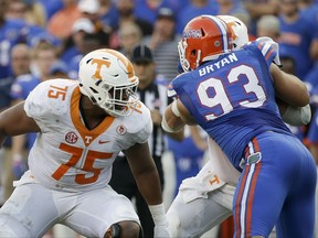 FILE - In this Sept. 26, 2015, file photo, Tennessee offensive lineman Jashon Robertson (75) plays against Florida defensive lineman Taven Bryan (93) in an NCAA college football game, in Gainesville, Fla. Robertson was one of the Tennessee seniors who arrived on campus three years ago amid expectations that they would lead the program back to Southeastern Conference title contention. It didn't quite work out that way. Only a fraction of that class remains as those seniors prepare to close their careers, and the coach who recruited them has been fired. (AP Photo/John Raoux, File)