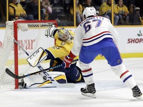 Nashville Predators goalie Pekka Rinne (35), of Finland, makes a stop against Montreal Canadiens left wing Max Pacioretty (67) during the first period of an NHL hockey game Wednesday, Nov. 22, 2017, in Nashville, Tenn. (AP Photo/Mark Humphrey)