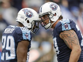 Tennessee Titans running back DeMarco Murray (29) celebrates with tackle Taylor Lewan, right, after Murray scored a touchdown on a 2-yard run against the Cincinnati Bengals in the first half of an NFL football game Sunday, Nov. 12, 2017, in Nashville, Tenn. (AP Photo/Mark Zaleski)