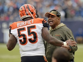 Cincinnati Bengals head coach Marvin Lewis talks with outside linebacker Vontaze Burfict (55) after Burfict was ejected for making contact with an official in the first half of an NFL football game against the Tennessee Titans Sunday, Nov. 12, 2017, in Nashville, Tenn. (AP Photo/Mark Zaleski)
