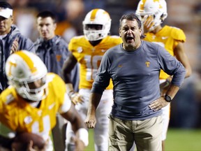 Tennessee interim coach Brady Hoke watches players warm up for an NCAA college football game against LSU on Saturday, Nov. 18, 2017, in Knoxville, Tenn. (AP Photo/Wade Payne)