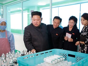 In this undated photo provided Sunday, Oct. 29, 2017, by the North Korean government shows North Korean leader Kim Jong Un, center, inspects products during a visit to a cosmetics factory in Pyongyang, North Korea At second from right is Kim's wife Ri Sol Ju. Independent journalists were not given access to cover the event depicted in this image distributed by the North Korean government. The content of this image is as provided and cannot be independently verified. (Korean Central News Agency/Korea News Service via AP)
