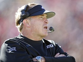 TCU coach Gary Patterson talks to his assistant coaches during the second half of the NCAA college football game against Texas Tech, Saturday, Nov. 18, 2017, in Lubbock, Texas. (AP Photo/Brad Tollefson)