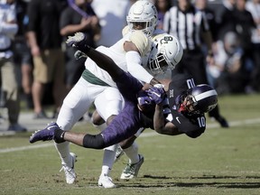 Baylor cornerback Jameson Houston (11) tackles TCU wide receiver Desmon White (10) during the first half of an NCAA college football game, Friday, Nov. 24, 2017, in Fort Worth, Texas. (AP Photo/Brandon Wade)