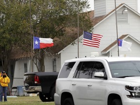 A law enforcement official continues to work the shooting scene at the First Baptist Church Wednesday, Nov. 8, 2017, in Sutherland Springs, Texas. A man opened fire inside the church in the small South Texas community on Sunday, killing more than two dozen and injuring others. (AP Photo/David J. Phillip)