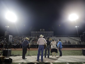 Musicians play during a vigil for the First Baptist Church shooting victims Tuesday, Nov. 7, 2017, in La Vernia, Texas. A man opened fire inside the church in the small South Texas community on Sunday, killing more than two dozen and injuring others. (AP Photo/David J. Phillip)