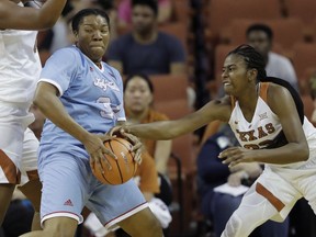 Louisiana Tech forward Alexus Malone (34) is pressured by Texas guard Ariel Atkins (23) during the first half of an NCAA college basketball game, Thursday, Nov. 30, 2017, in Austin, Texas. (AP Photo/Eric Gay)