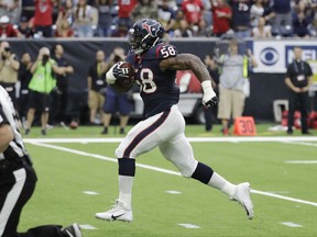 Houston Texans linebacker Lamarr Houston (58) returns a fumble recovery for a touchdown against the Indianapolis Colts during the first half of an NFL football game, Sunday, Nov. 5, 2017, in Houston. (AP Photo/David J. Phillip)