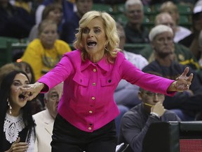 Baylor coach Kim Mulkey directs her team during the first half of an NCAA college basketball game aganst Lamar, Friday. Nov. 10, 2017, in Waco, Texas. (AP Photo/Jerry Larson)