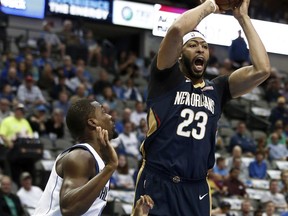 New Orleans Pelicans forward Anthony Davis (23) is defended by Dallas Mavericks forward Harrison Barnes during the first period of an NBA basketball game, Friday, Nov. 3, 2017, in Dallas. (AP Photo/Mike Stone)
