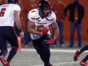 Texas Tech running back Justin Stockton (4) runs the ball during the first half of an NCAA college football game against Texas, Friday, Nov. 24, 2017, in Austin, Texas. (AP Photo/Michael Thomas)