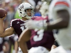 Texas A&M quarterback Kellen Mond (11) passes down field against Auburn during the first half of an NCAA college football game on Saturday, Nov. 4, 2017, in College Station, Texas. (AP Photo/Sam Craft)