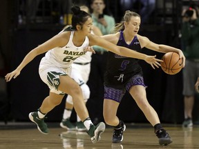Baylor's Natalie Chou (24) reaches in as Central Arkansas' Maddie Goodner (5) attempts to maintain control of the ball during the first half of an NCAA college basketball game, Tuesday, Nov. 14, 2017, in Waco, Texas. (AP Photo/Tony Gutierrez)