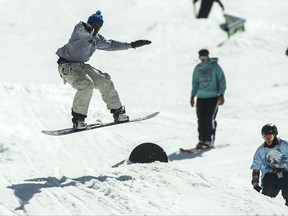 In this March 28, 2017, file photo, skiers and snowboarders are shown in the terrain park at Park City Mountain Resort, in Park City, Utah. Utah ski officials kick off the new season energized by the growing possibility of another Winter Olympics bid and buoyed by two straight seasons of record visitation. But there's also some concern that publicity surrounding the state's strict new DUI law that goes into effect next year may keep skiers and snowboarders away by adding to the long-held stigma that visitors can't have fun in Utah. (Chris Detrick/The Salt Lake Tribune via AP, File)