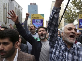 Demonstrators chant slogans during an annual rally marking the anniversary of the 1979 U.S. Embassy takeover in Tehran, Iran, Saturday, Nov. 4, 2017. Iran on Saturday displayed a surface-to-surface missile as part of events marking the anniversary of the 1979 U.S. Embassy takeover and hostage crisis amid uncertainty about its nuclear deal with world powers. (AP Photo/Vahid Salemi)