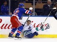 New York Rangers defenceman Brendan Smith (left) steps into Vancouver Canucks forward Jake Virtanen on Nov. 26.