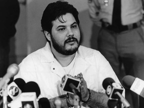 FILE - In this 1991 file photo, Joseph M. Giarratano, who was stabbed on July 4, 1996, at Buckingham Correctional Center, speaks with members of the media in Buckingham, Va. Giarratano, who had his sentence commuted to life in prison more than two decades ago, has been granted parole. The Richmond Times-Dispatch reports the Virginia State Parole Board on Monday, Nov. 20, 2017, approved Giarratano for release. (Lindy Keast Rodman/Richmond Times-Dispatch via AP, File)