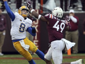 FILE - In this Nov. 18, 2017, file photo, Virginia Tech linebacker Tremaine Edmunds (49) rushes Pittsburgh quarterback Kenny Pickett (8) in the second half of an NCAA college football game in Blacksburg, Va. The junior is one of five finalists for the Butkus Award, which goes to the top linebacker in the country.  (Matt Gentry/The Roanoke Times via AP, File)