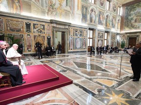 Pope Francis listens to President of Nauru Baron Waqa on the occasion of his meeting with a delegation of Pacific leaders in the Clementine Hall, at the Vatican, Saturday, Nov. 11, 2017. Francis met Saturday with a delegation of Pacific leaders and told them he shares their concerns about rising sea levels and increasingly intense storms that are threatening their small islands. (L'Osservatore Romano/Pool Photo via AP)