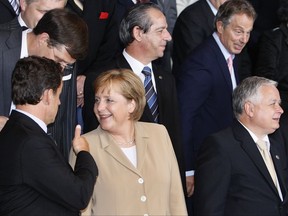 FILE - In this June 21, 2007 file photo, EU leaders pose for the group photo at the EU summit in Brussels. Germany, Europe's largest economy and anchor of stability, is facing the prospect of months of political uncertainty after Chancellor Angela Merkel's conservatives were unable to form a coalition with two smaller parties, raising the likelihood of new elections. (Philippe Wojazer/Pool Photo via AP, File)