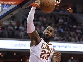 Cleveland Cavaliers forward LeBron James dunks during the first half of an NBA basketball game against the Washington Wizards, Friday, Nov. 3, 2017, in Washington. (AP Photo/Nick Wass)