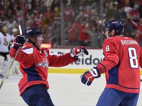 Washington Capitals left wing Alex Ovechkin (8), of Russia, celebrates his goal with center Nicklas Backstrom, of Sweden, during the first period of an NHL hockey game against the Ottawa Senators, Wednesday, Nov. 22, 2017, in Washington. (AP Photo/Nick Wass)