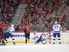 Washington Capitals left wing Alex Ovechkin, left, of Russia, celebrates his goal with Washington Capitals center Nicklas Backstrom (19), of Sweden, against Tampa Bay Lightning goalie Andrei Vasilevskiy (88), of Russia, defenseman Victor Hedman (77), of Sweden, and defenseman Andrej Sustr (62), of Czech Republic, during the first period of an NHL hockey game, Friday, Nov. 24, 2017, in Washington. (AP Photo/Nick Wass)