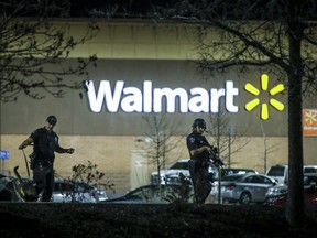 Police investigate the scene of a shooting at a Walmart store in the Thorton Town Center shopping plaza on Nov. 1, 2017 in Colorado. Three people were killed.