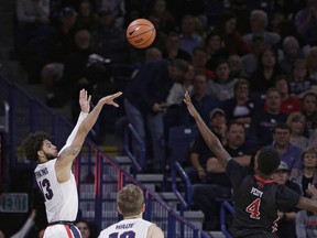 Gonzaga guard Josh Perkins (13) shoots against Incarnate Word forward Christian Peevy (4) during the first half of an NCAA college basketball game in Spokane, Wash., Wednesday, Nov. 29, 2017. (AP Photo/Young Kwak)