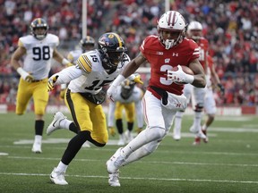 Wisconsin's Kendric Pryor runs for a touchdown during the first half of an NCAA college football game against Iowa Saturday, Nov. 11, 2017, in Madison, Wis. (AP Photo/Morry Gash)