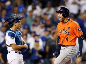 Houston Astros outfielder George Springer (right) celebrates his second-inning home run in Game 7 of the World Series against the Los Angeles Dodgers on Nov. 1.