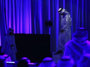 Saudi Energy Minister Khalid al-Falih walks off stage after giving a speech in Dubai, United Arab Emirates, Tuesday, Nov. 28, 2017. The energy ministers of Saudi Arabia and the United Arab Emirates both said Tuesday that those wanting to know whether OPEC will extend its production cuts will have to wait until the cartel's upcoming Vienna meeting on Thursday. (AP Photo/Jon Gambrell)