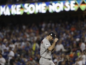 Houston Astros starting pitcher Justin Verlander reacts after giving up a single to Los Angeles Dodgers' Yasiel Puig during the second inning of Game 6 of baseball's World Series Tuesday, Oct. 31, 2017, in Los Angeles. (AP Photo/Matt Slocum)
