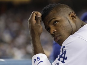 Los Angeles Dodgers' Yasiel Puig watches during the second inning of Game 7 of baseball's World Series against the Houston Astros Wednesday, Nov. 1, 2017, in Los Angeles. (AP Photo/Matt Slocum)