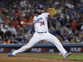 Los Angeles Dodgers relief pitcher Kenley Jansen throws during the eighth inning of Game 6 of baseball's World Series against the Houston Astros Tuesday, Oct. 31, 2017, in Los Angeles. (AP Photo/Matt Slocum)