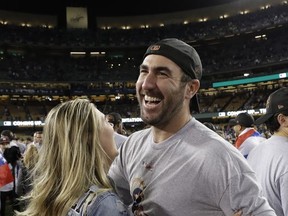 Houston Astros' Justin Verlander celebrates with Kate Upton after Game 7 of baseball's World Series against the Los Angeles Dodgers Wednesday, Nov. 1, 2017, in Los Angeles. The Astros won 5-1 to win the series 4-3. (AP Photo/Matt Slocum)