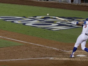 Los Angeles Dodgers' Chris Taylor hits a RBI double off Houston Astros starting pitcher Justin Verlander during the sixth inning of Game 6 of baseball's World Series Tuesday, Oct. 31, 2017, in Los Angeles. (AP Photo/Jae C. Hong)